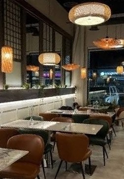 The Elio's dining room with rattan pendant lights